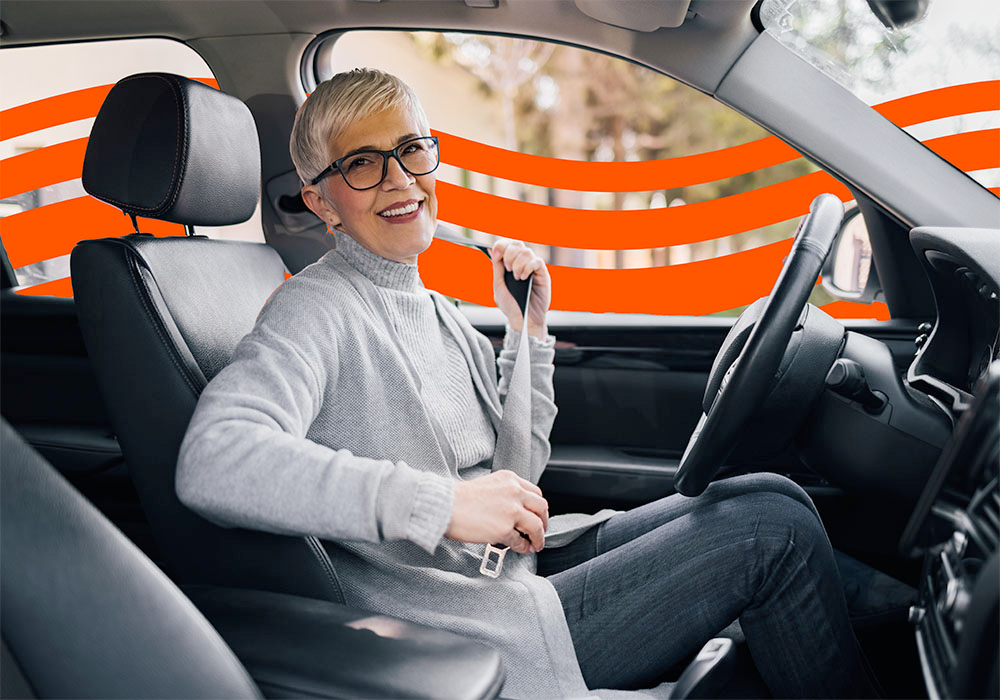 Happy driver comparing quotes on a tablet, representing savings